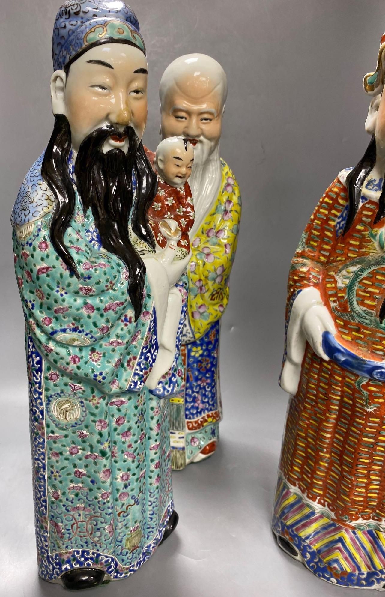 A group of three Chinese porcelain immortals, 47cm